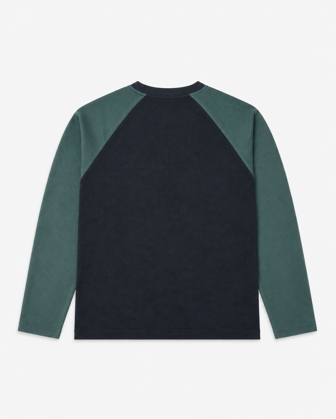 A long-sleeve raglan-style top shown from the back, featuring a dark navy body and muted green sleeves, laid flat against a light gray background.
