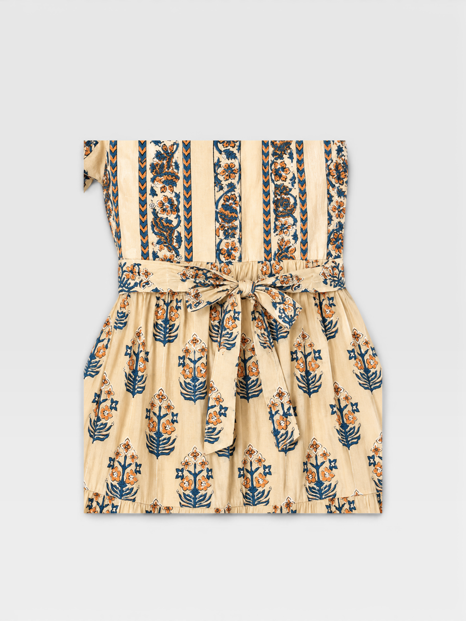 Beige dress with blue and orange floral hand block pattern on a light beige background