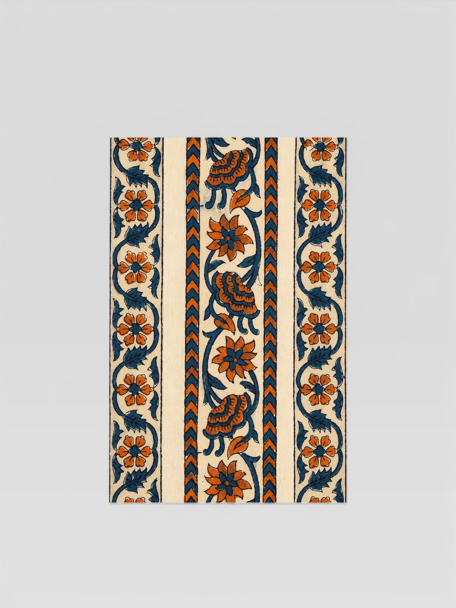 Decorative fabric strip with hand block painted floral patterns on a beige background