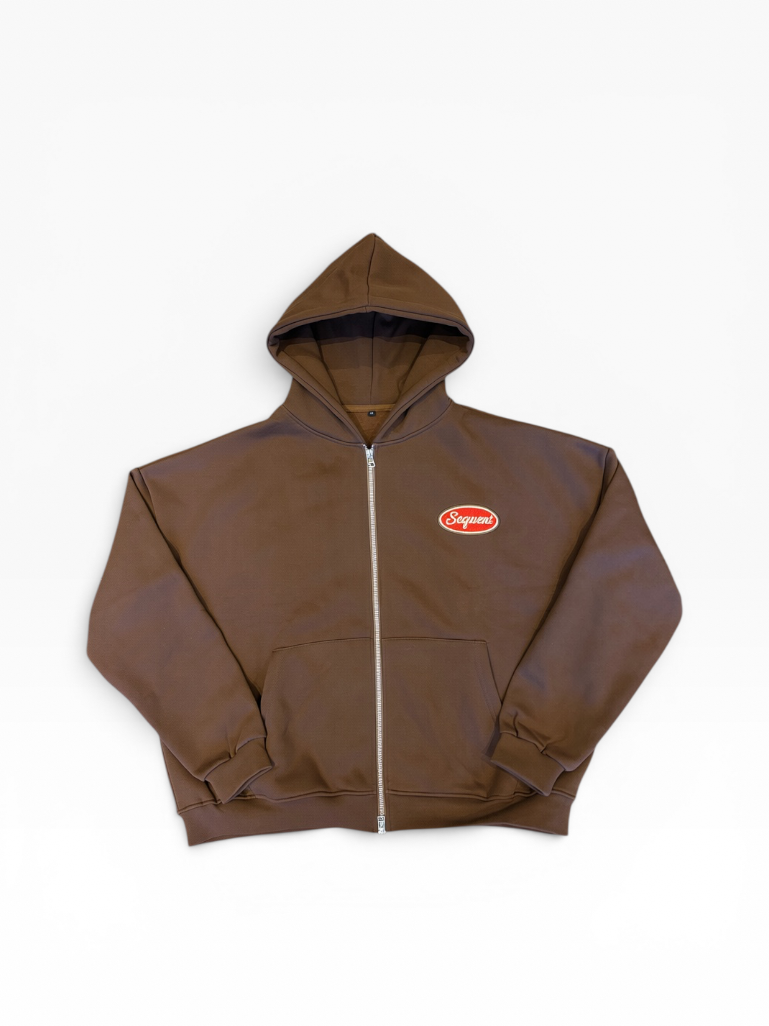 A brown zip-up hoodie with a small red and white Supreme logo patch on the left chest, displayed flat against a clean white background.
