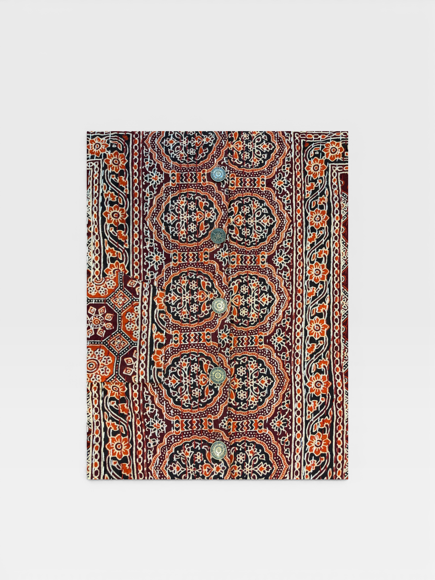 Decorative Ajrakh Kantha shirt with intricate paisley pattern on a white background