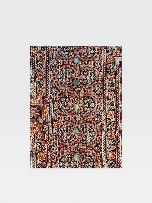 Decorative Ajrakh Kantha shirt with intricate paisley pattern on a white background