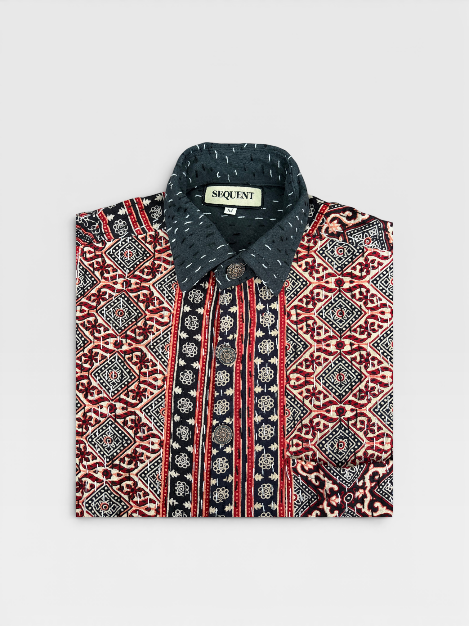 Ajrakh Kantha Patterned shirt with a visible 'Sequent' brand label on a light gray background