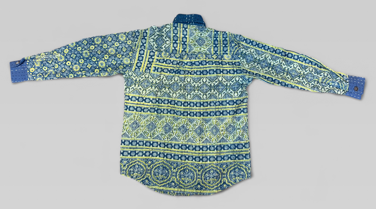 Blue and green patterned Ajrakh Kantha shirt on a gray background