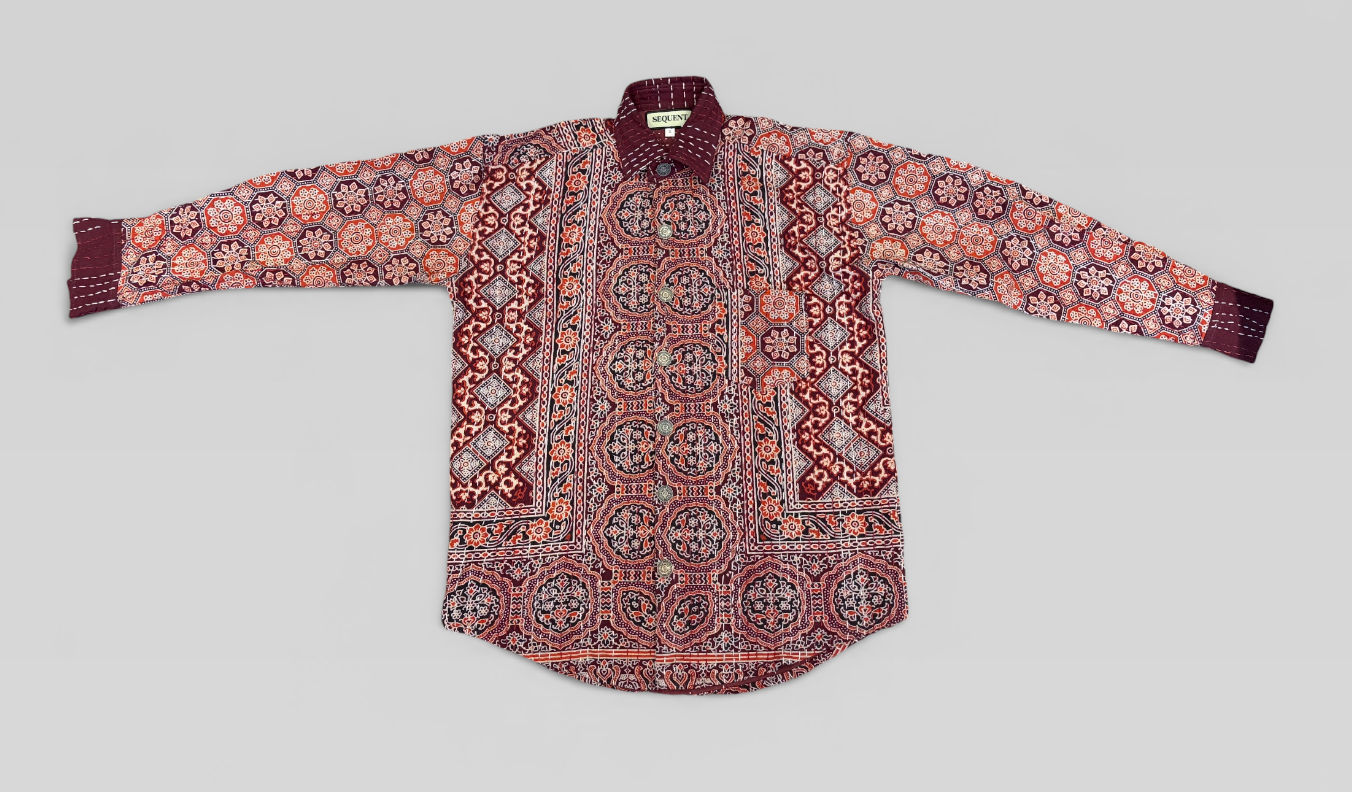 Traditional patterned Ajrakh kantha shirt on a light gray background