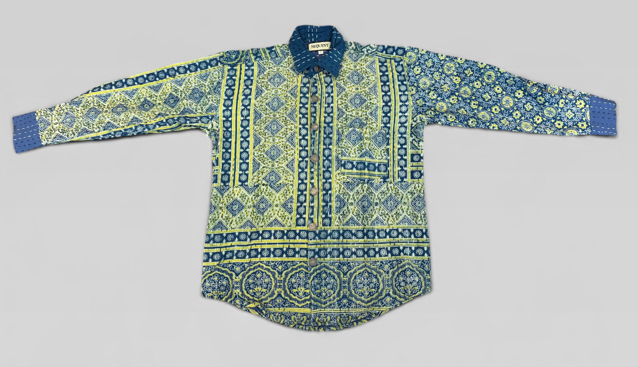 Long-sleeve shirt with blue and green hand block painted Ajrakh Kantha shirt on a gray background