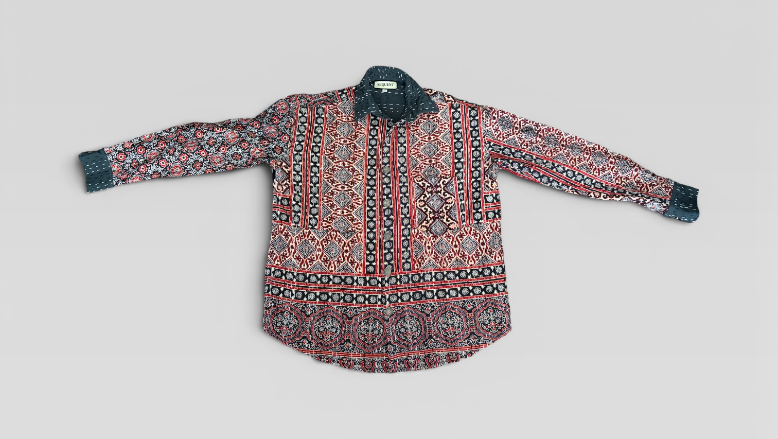 Floral patterned Ajrakh kantha shirt with long sleeves on a light gray background
